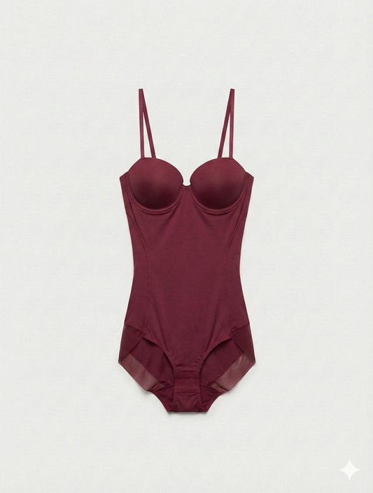 Maroon swimsuit with thin straps on a light gray background